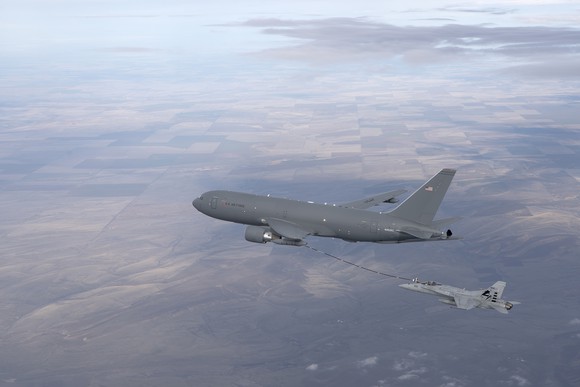 A Boeing KC-46 Pegasus tanker refueling another military jet in flight.