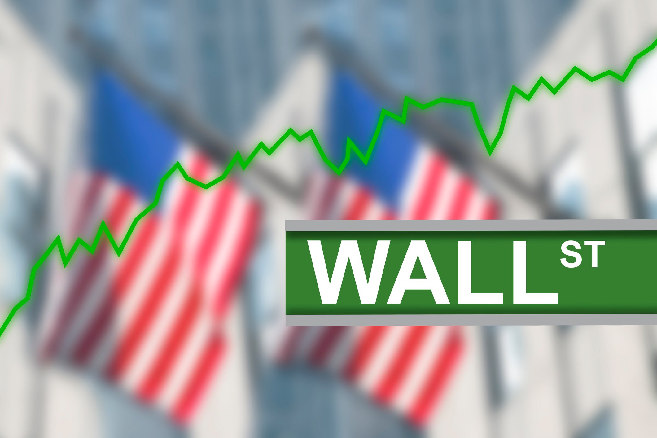 Wall Street sign with U.S. flags in the background and a green stock chart trending up.