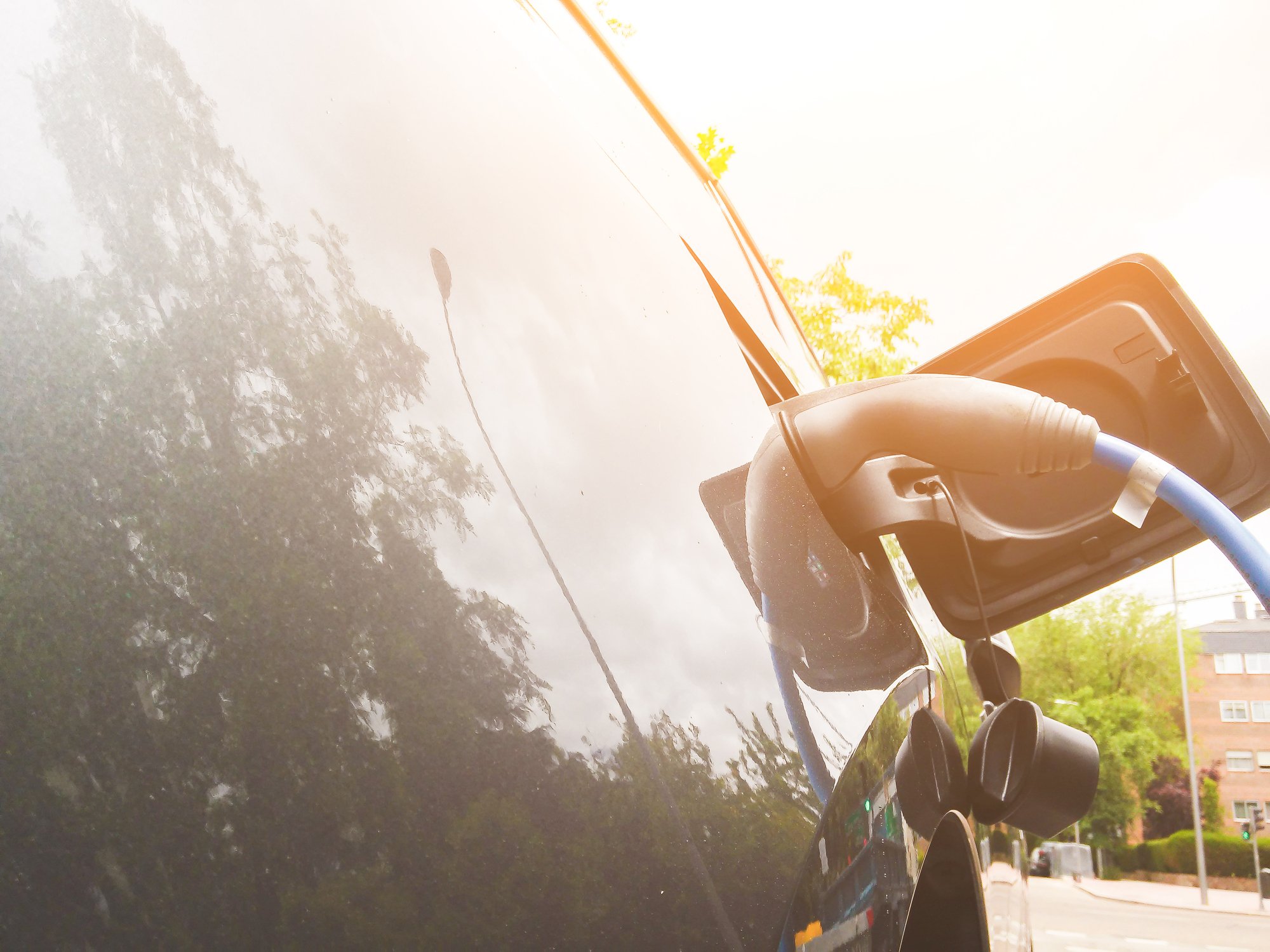 Electric charging plug in side of car. 