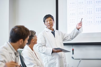 scientist-presenting-to-investors-getty