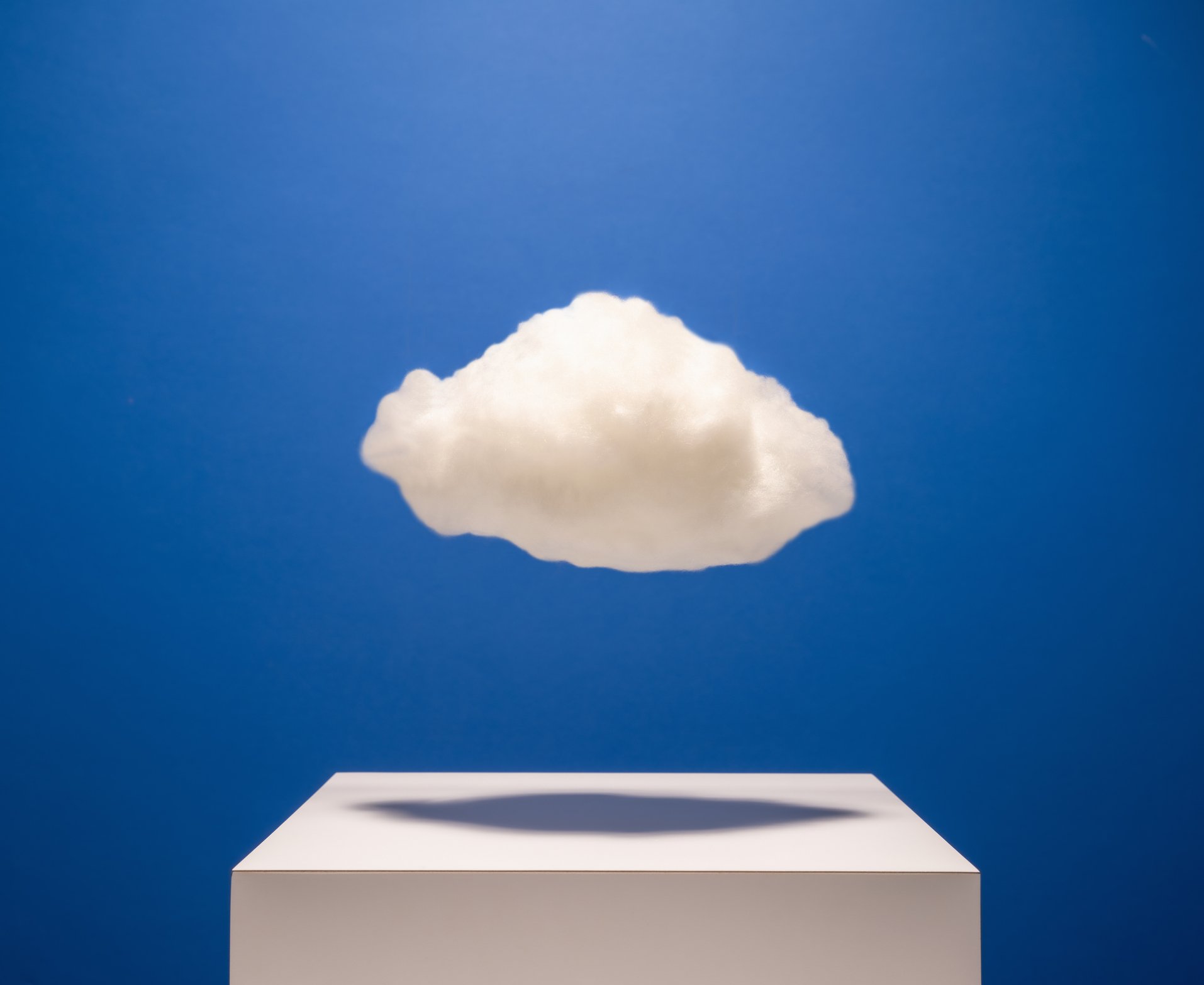 A cloud floating above a box.