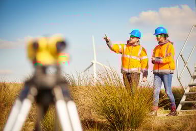 People near a wind turbine.