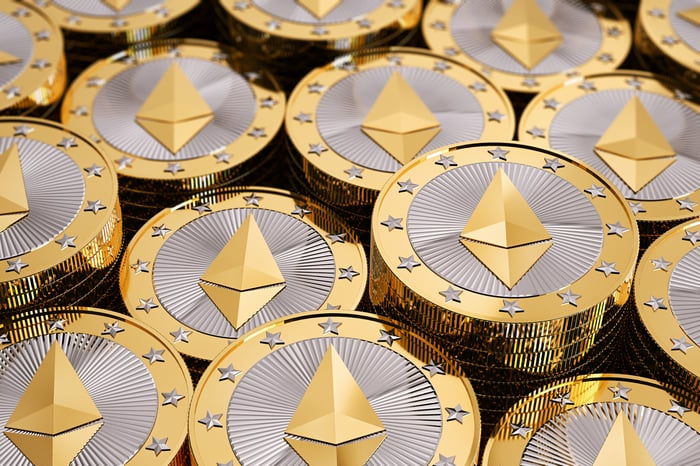 Coins bearing the emblem of the cryptocurrency Ethereum.