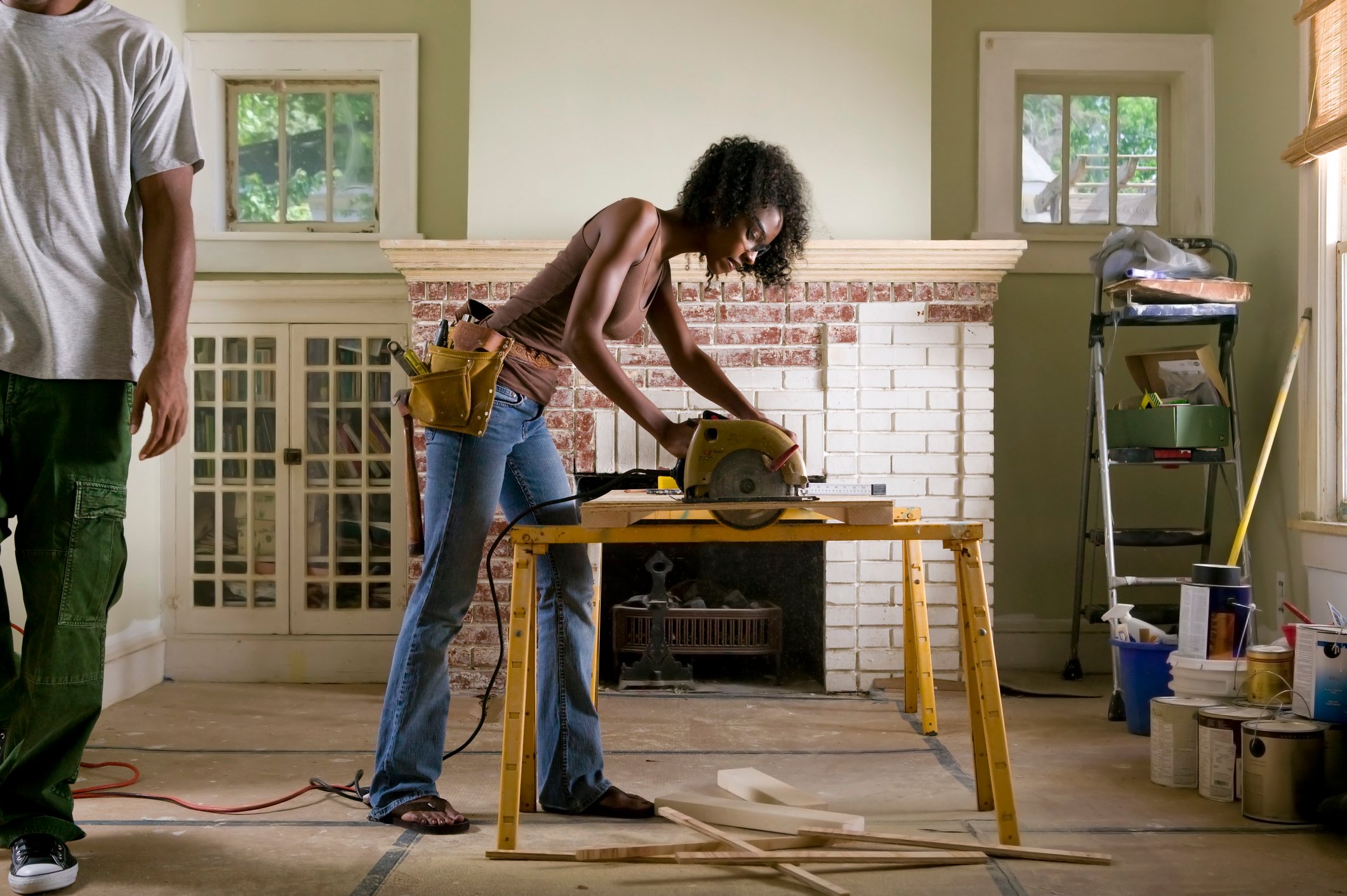 A person uses a circular saw to do home improvements.