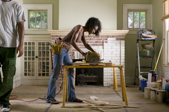 A person uses a circular saw to do home improvements.