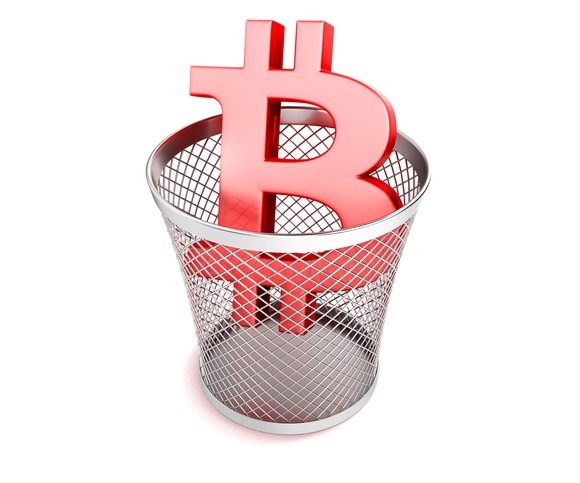 Bitcoin symbol in a trash can.