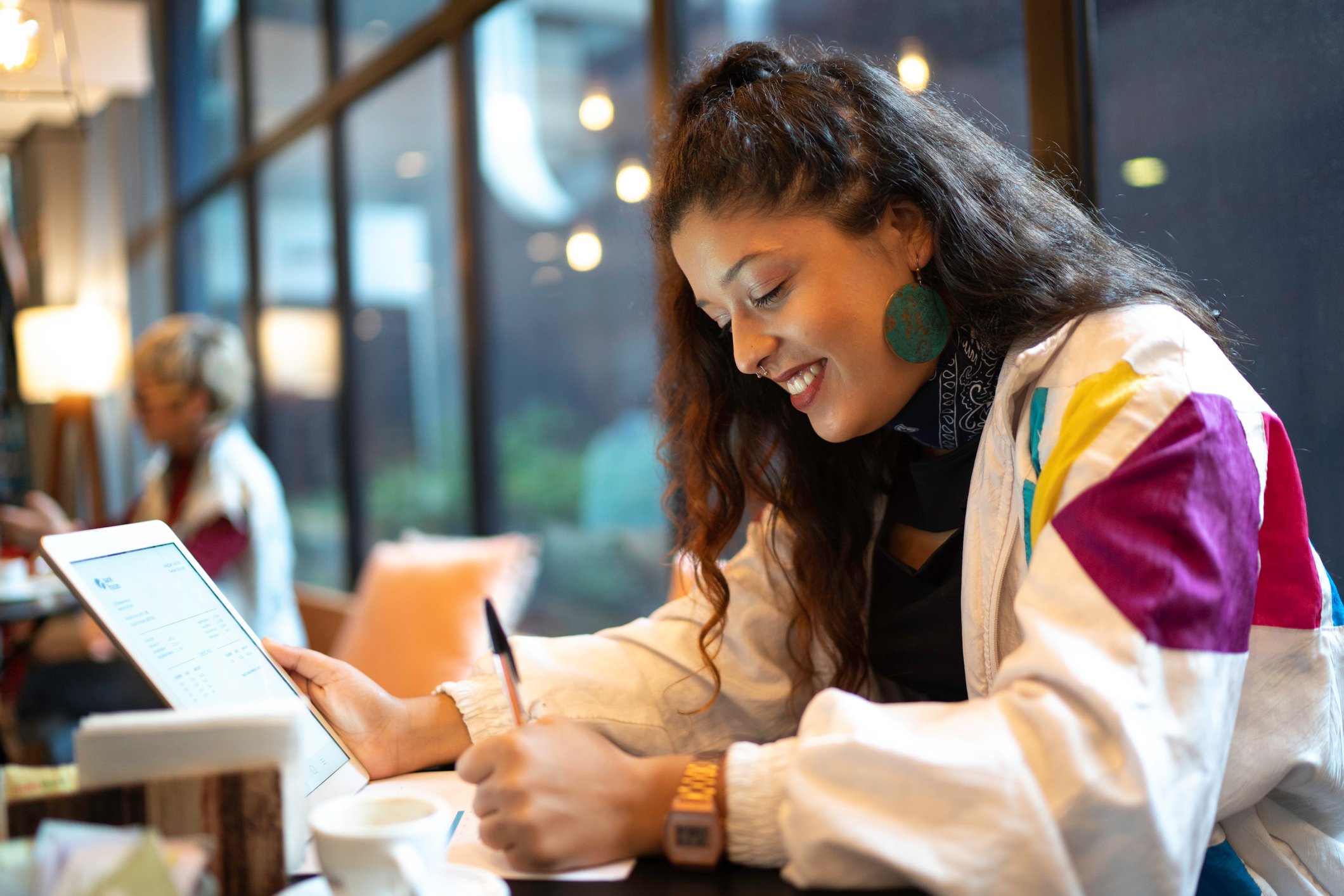 Young woman studies on her laptop. 