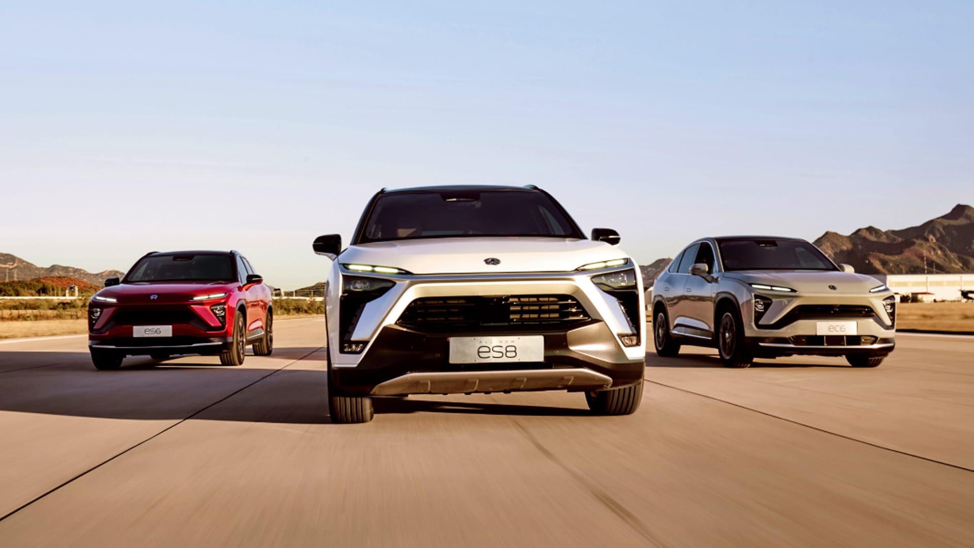 3 NIO electric vehicles on the road. 