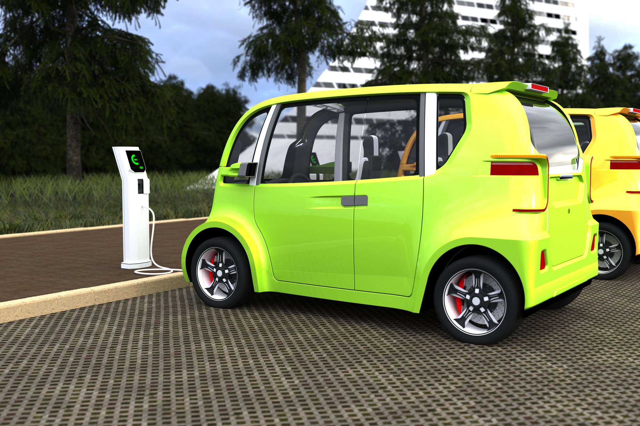 Green/yellow electric vehicle charging at a charging station.