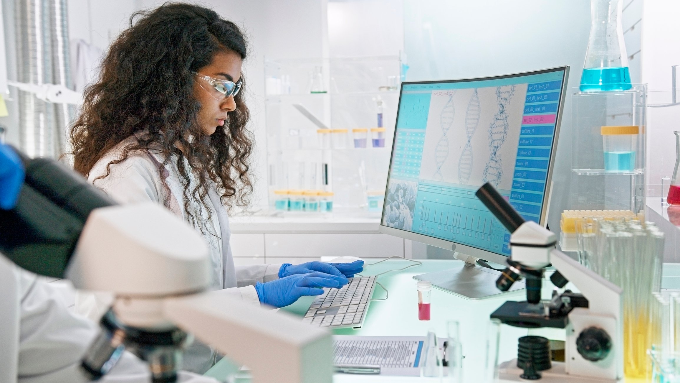 Scientist uses a computer to conduct research.