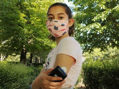 getty-girl-mask-diabetes-cgm