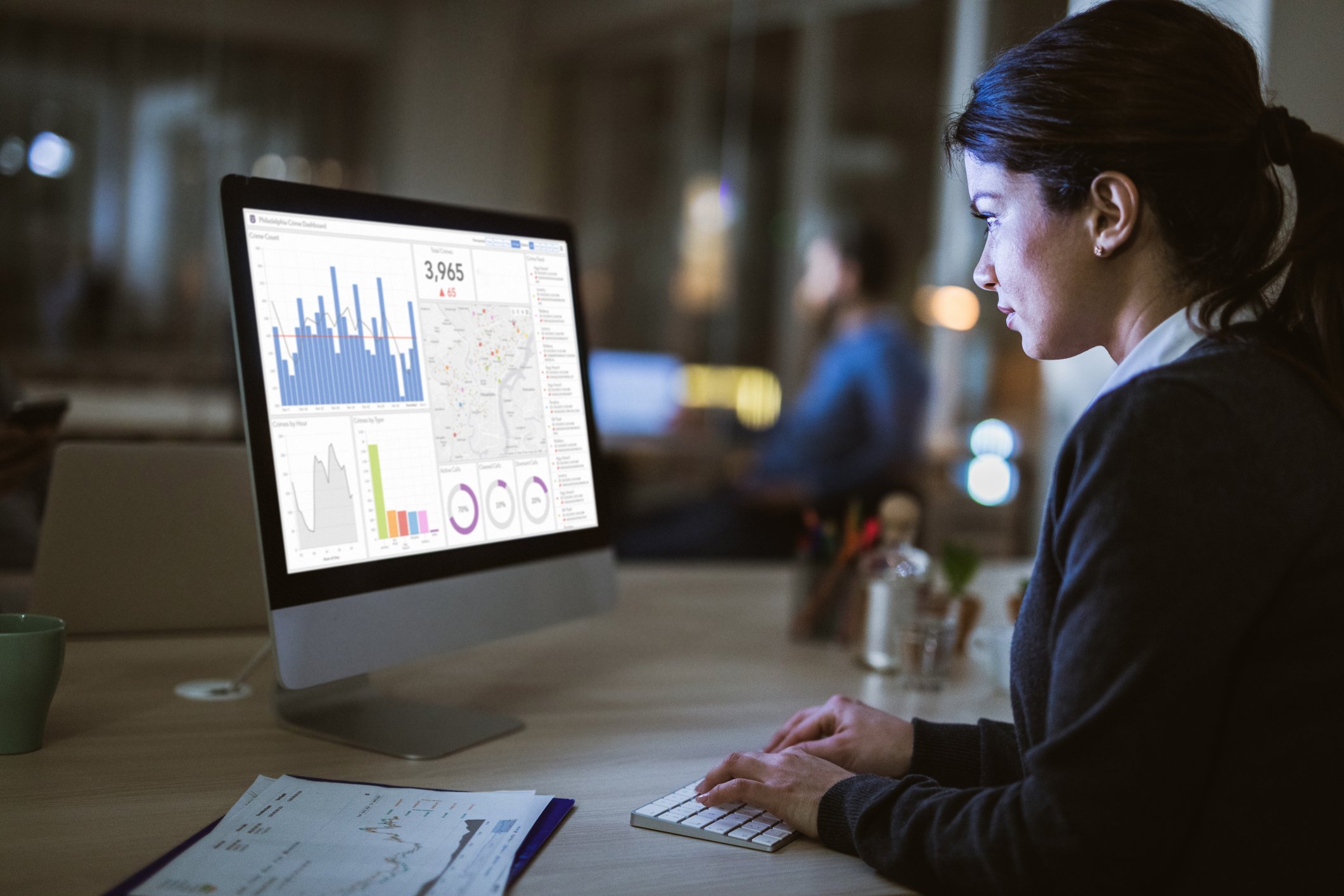 A woman looking at a computer screen.