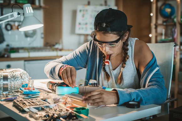 Girl building a computer