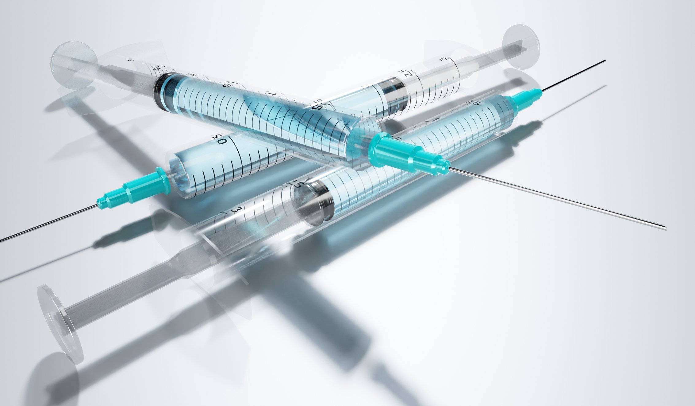 Three syringes with needles.
