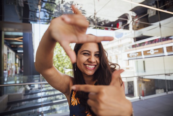 person viewing their point of view through their hands