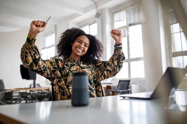 A happy woman with her arms in the air