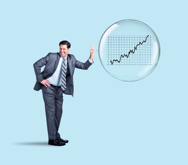 businessman popping stock market bubble
