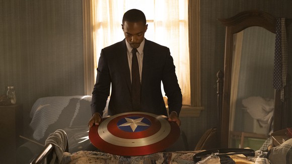 Falcon holding Captain America's shield.