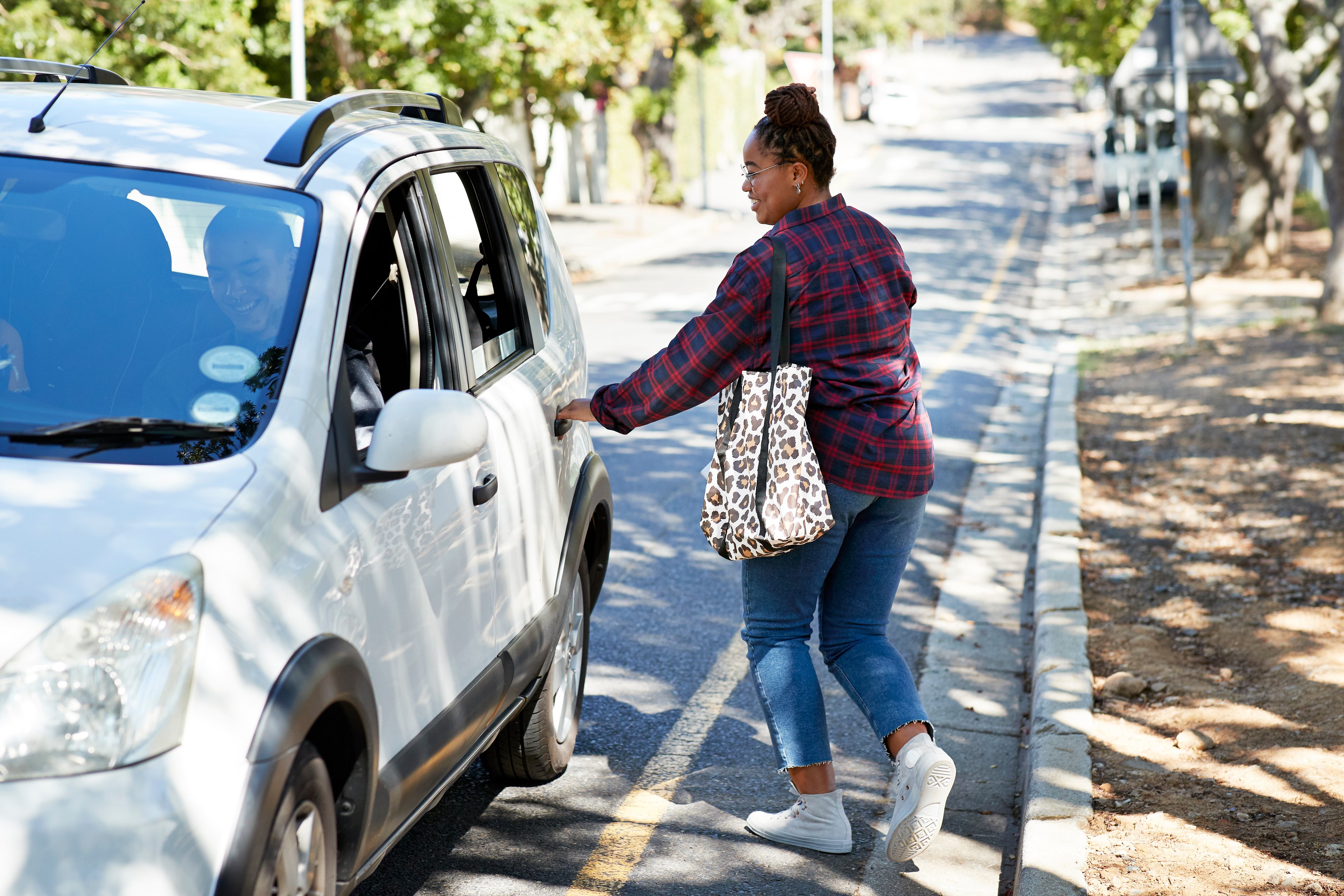 A person hailing a ride from a ride-share app. 
