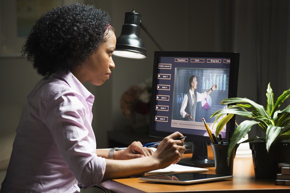 Woman taking business class on computer