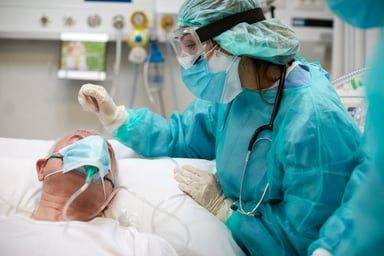 COVID-19 patient in hospital bed