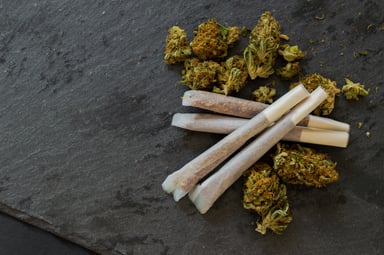 Pile of marijuana flowers and joints