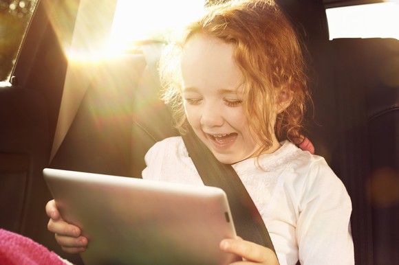 A child looking at a tablet.