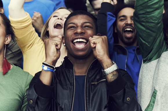 Person cheers on as a victory is achieved.