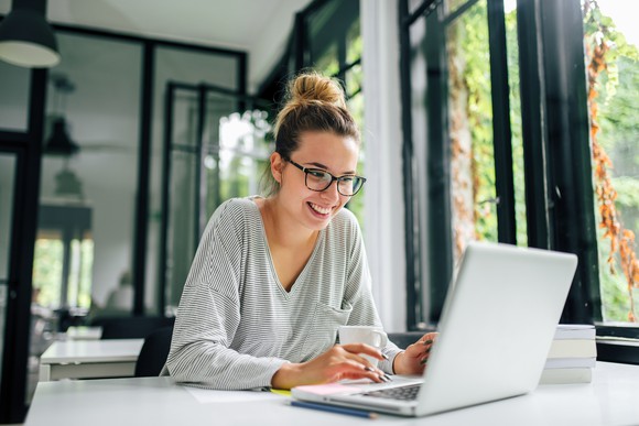 A person sitting at a computer.