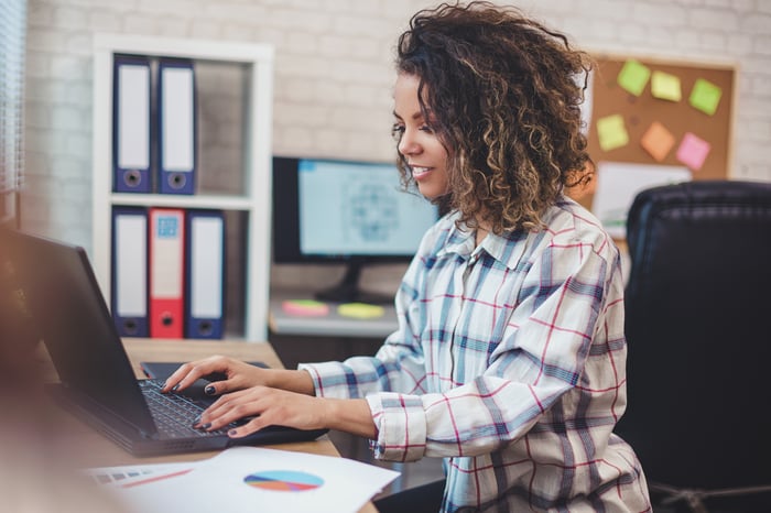 Young person working on laptop