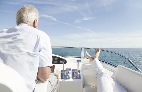 A retired couple heading out to see on their yacht.