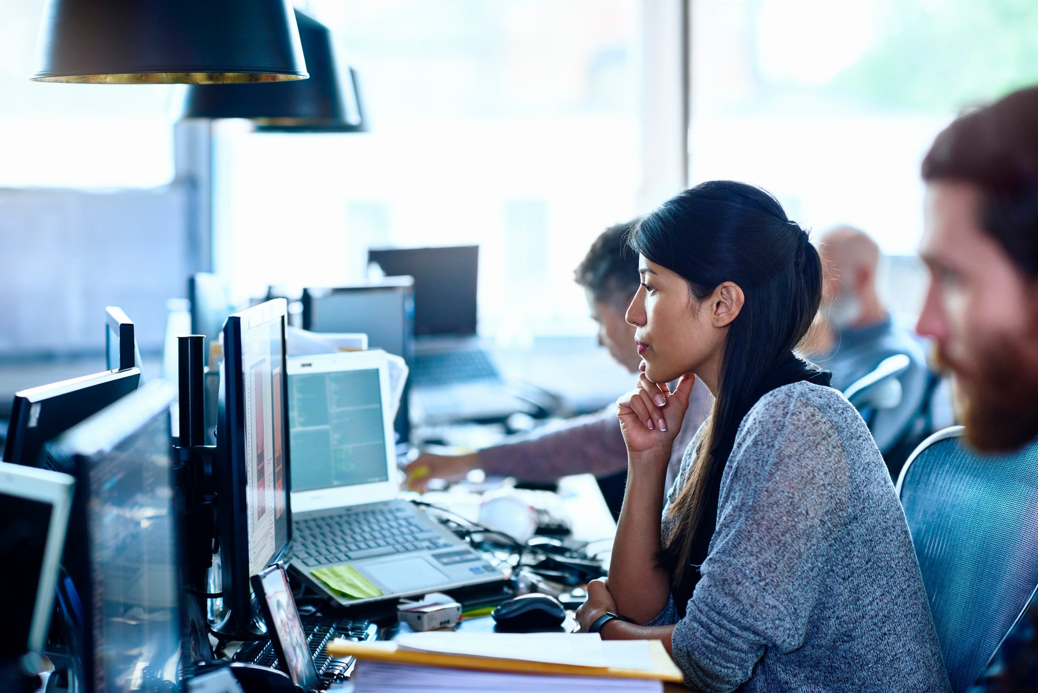 A woman sitting in an office.