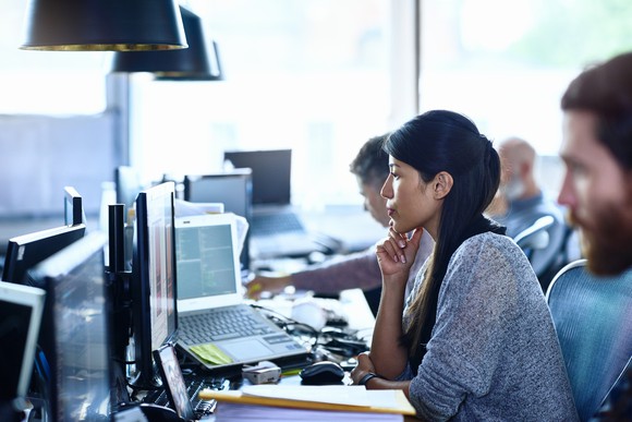 A woman sitting in an office.