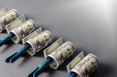 Getty-Hundred-Dollar-Bills-On-Rollers