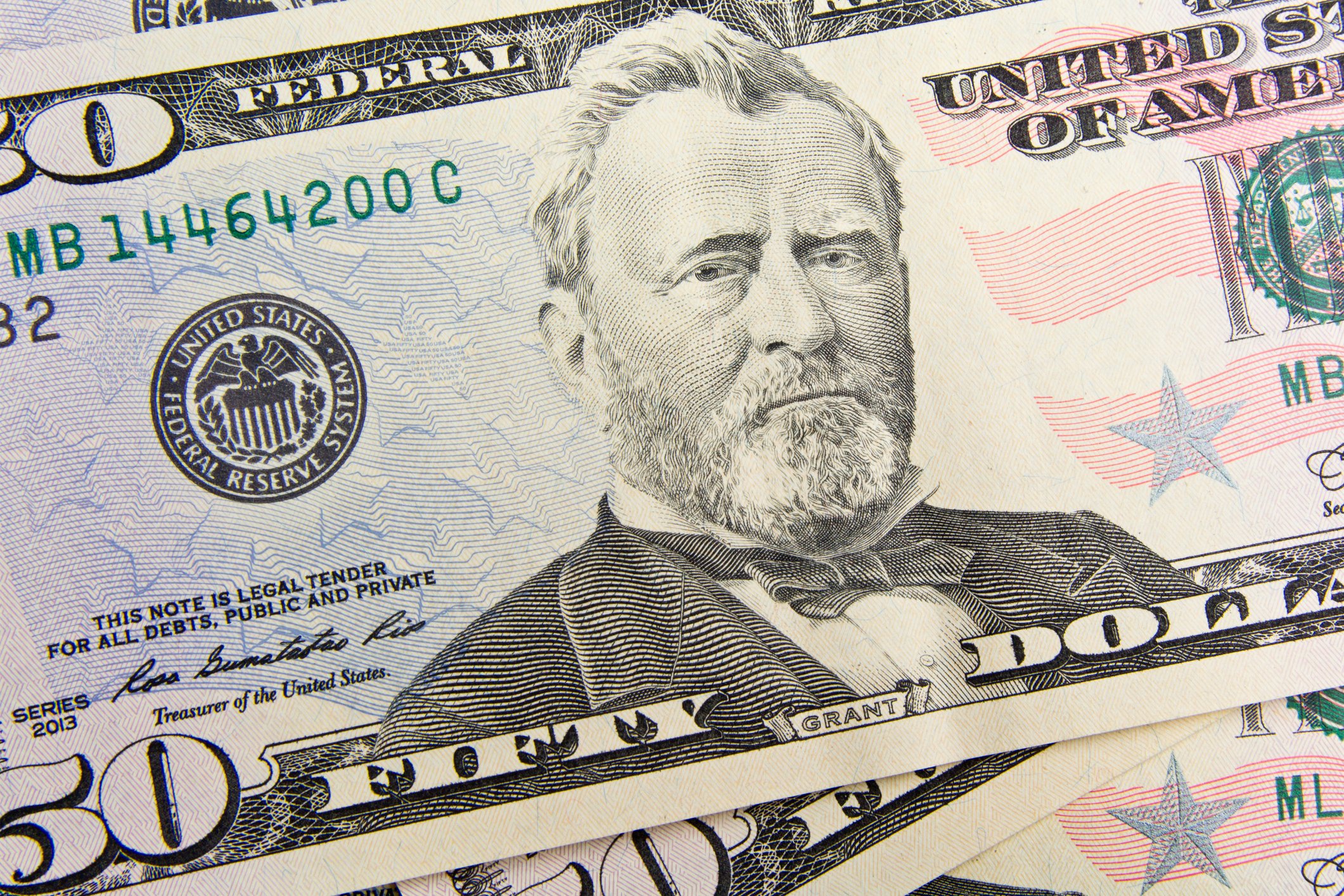 An up-close view of President Ulysses S. Grant's portrait on a fifty dollar bill. 