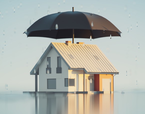 A home covered by a large umbrella.