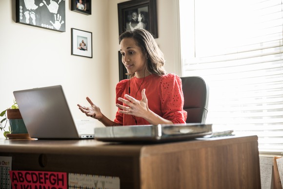An office worker communicating over a video call.