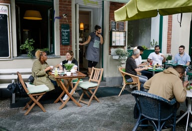 people eating outside at a restaurant