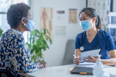Asian female doctor meeting patient