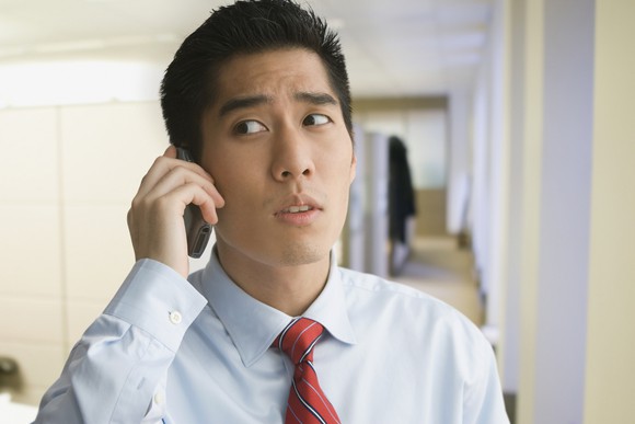 Man talking on cellphone looks worried