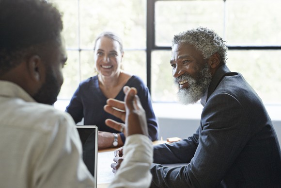 People talking at a table.