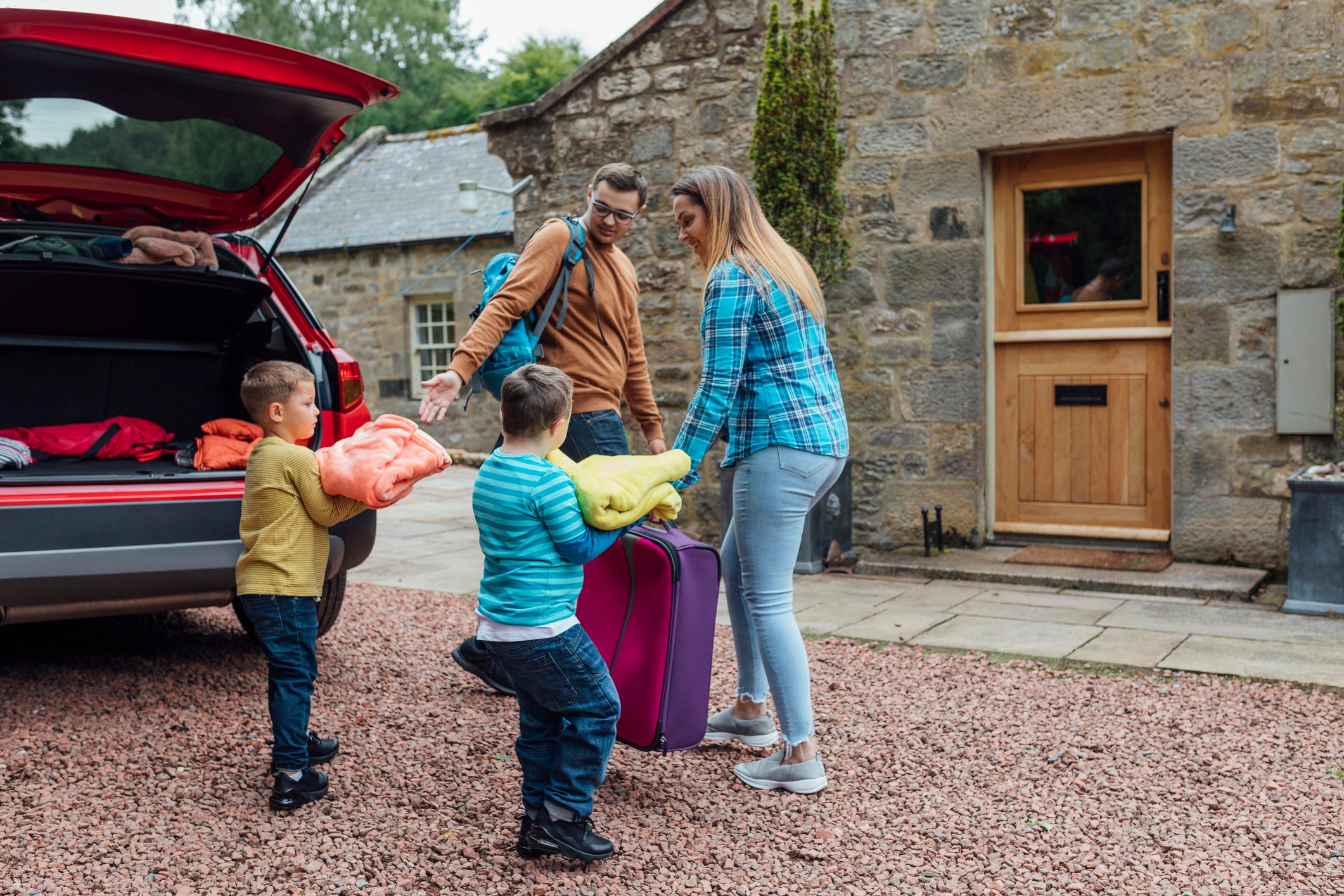 A family arriving at a home.