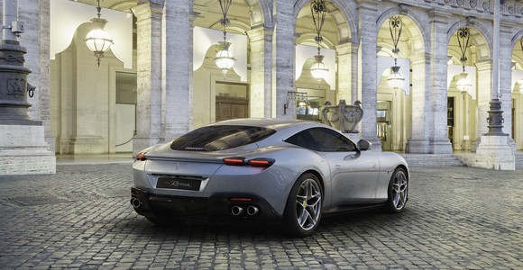 A silver Ferrari Roma, a sleek front-engined grand touring car. 