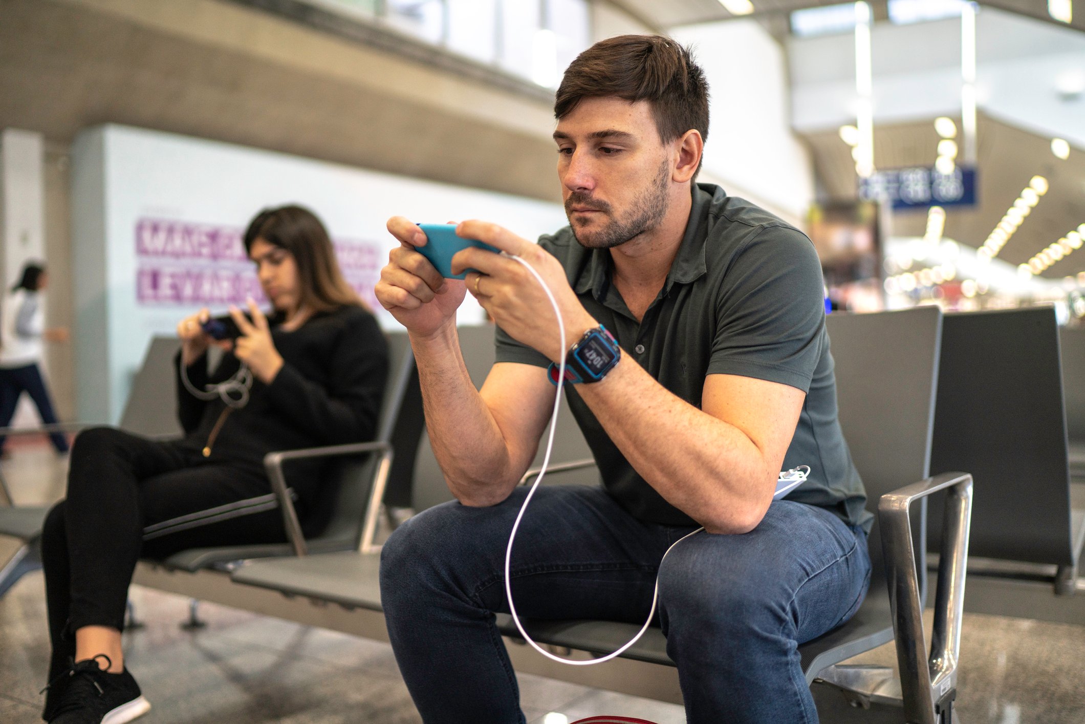 A man looking at this phone.