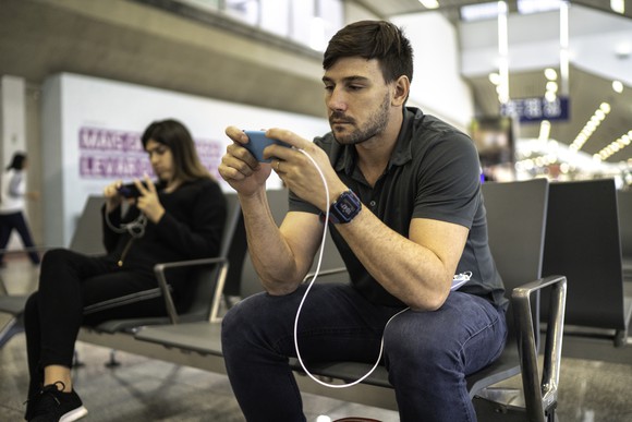 A man looking at this phone.