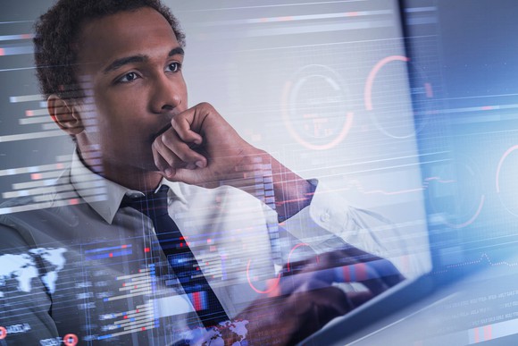 Investor reviewing financial data.