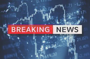 Stock crash breaking news flashing on a screen.