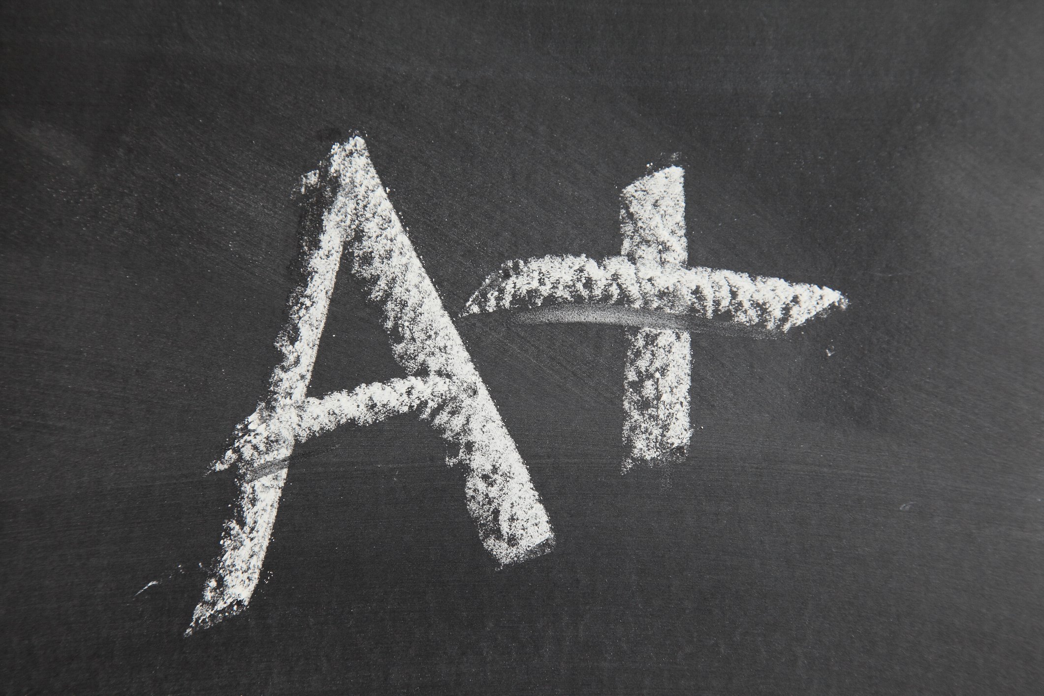 A+ written in chalk on a blackboard