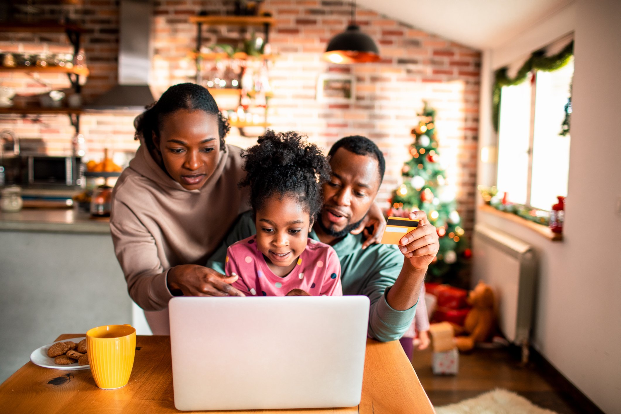 A family shops for gifts online.