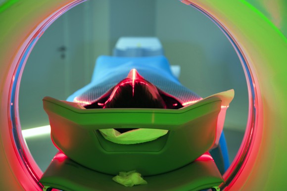 A person going through a medical imaging system.